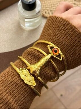 Schiaparelli Inspired Gold  Cuff Bracelet Set with Orange/yellowish Accent Eye